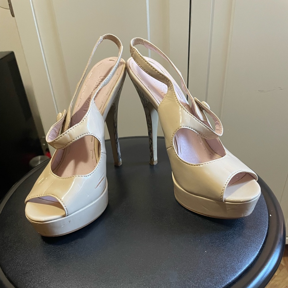 Size 7, nude peep toe with animal print heel